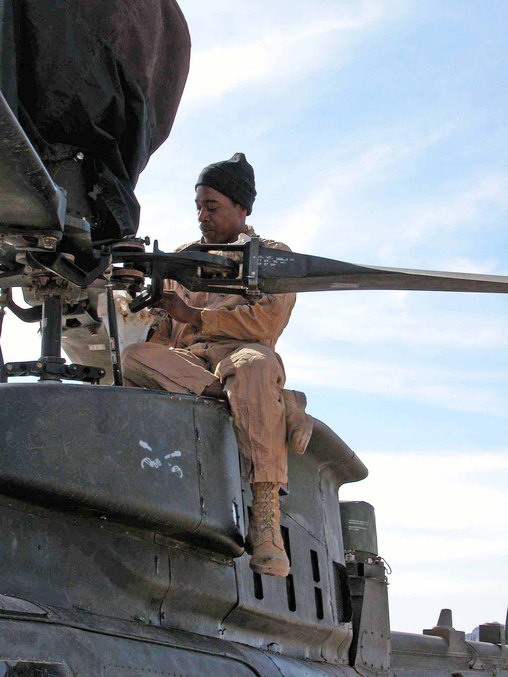 (Cav) Maintainer Inspects Kiowa Warrior in Afghanistan