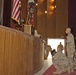 Three Soldiers pay their final respect at the memorial