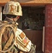 Sgt. Wilding peers in side a store during a routine patrol