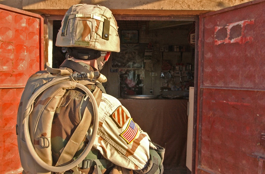 Sgt. Wilding peers in side a store during a routine patrol