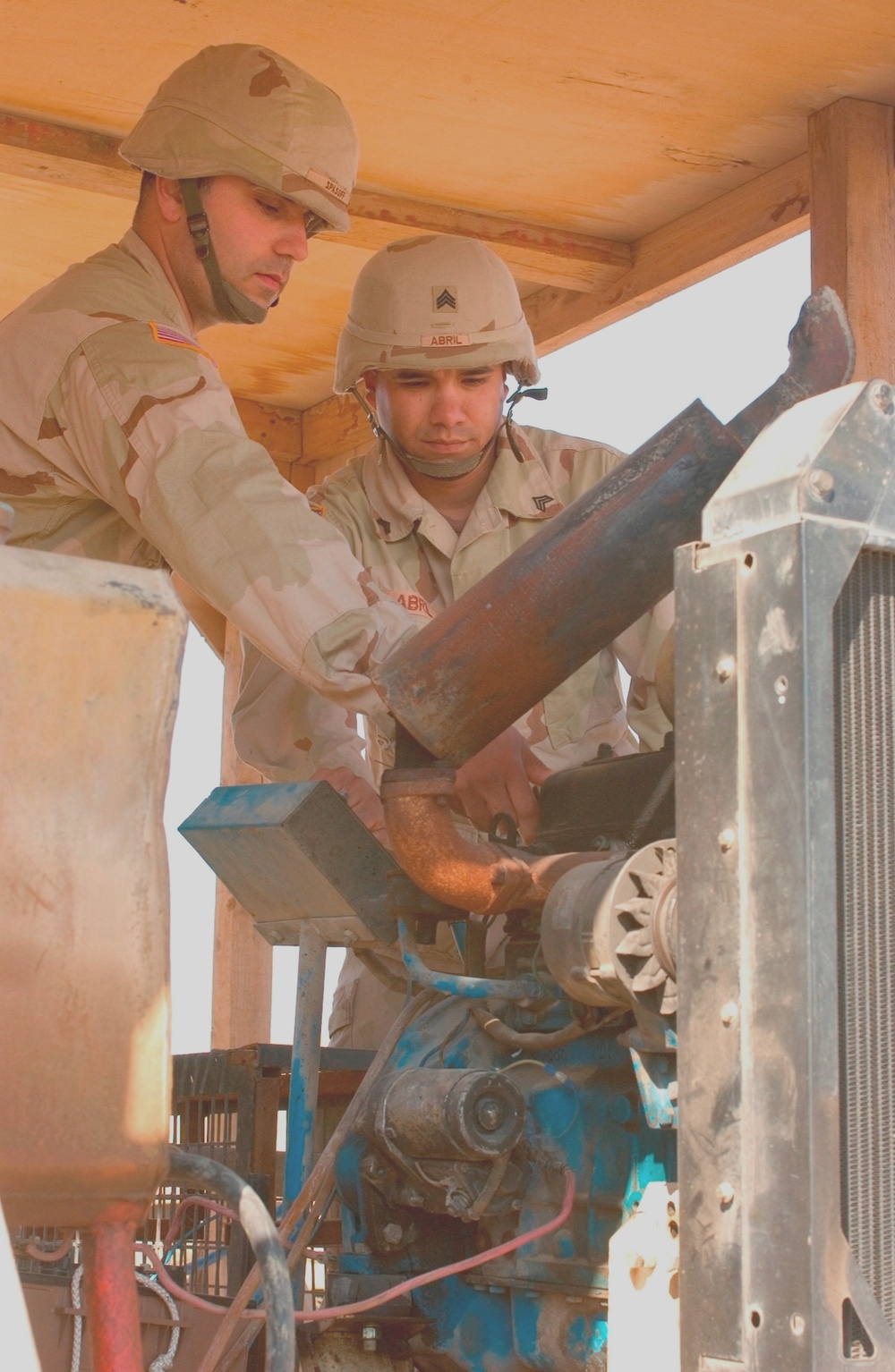 Soldiers Start a Generator So They Can Start Their Process