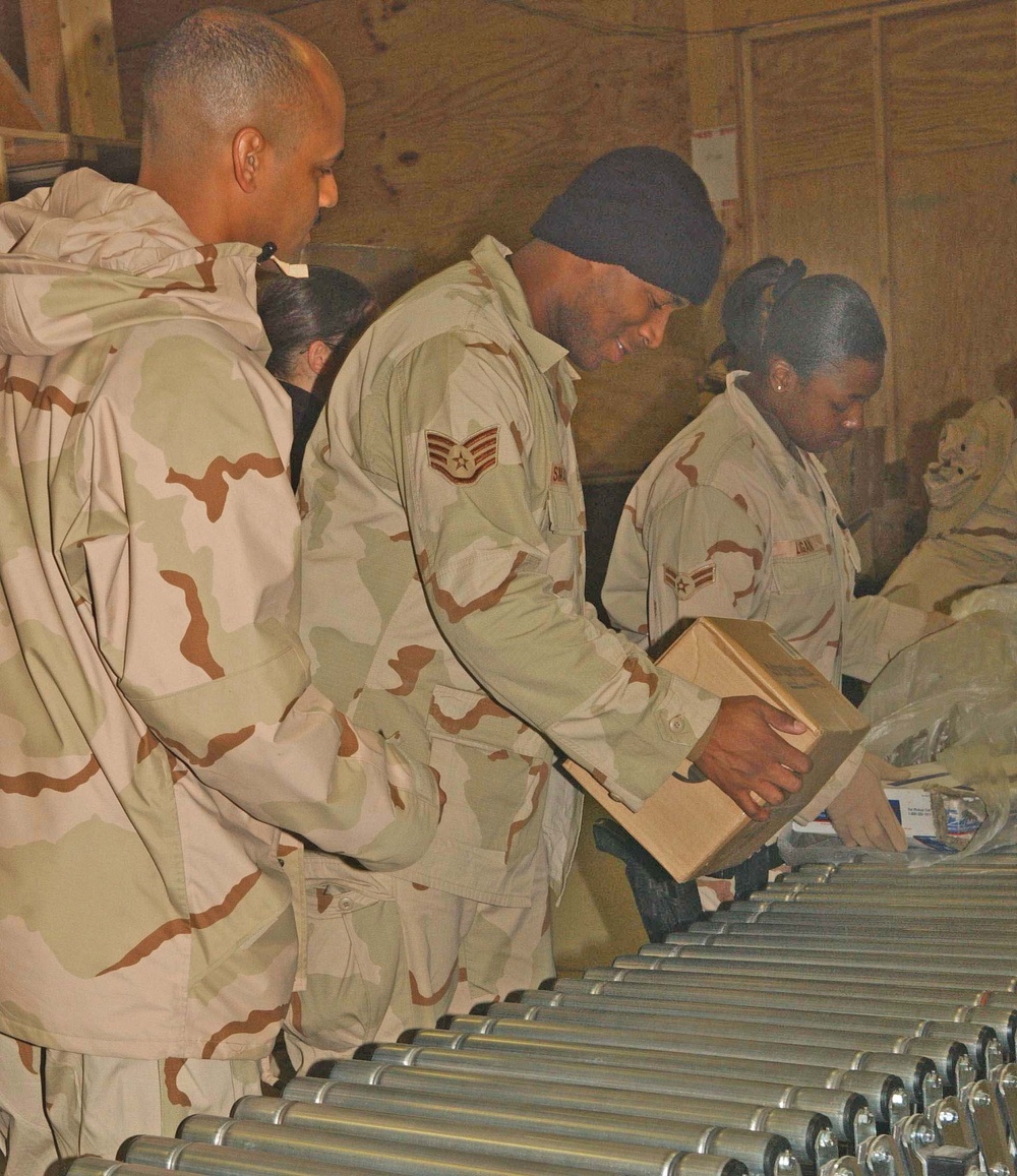 Members of the Air Force mail team at Bagram work together