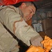 SSgt. Rick Kandrach unloads bags of letters and packages