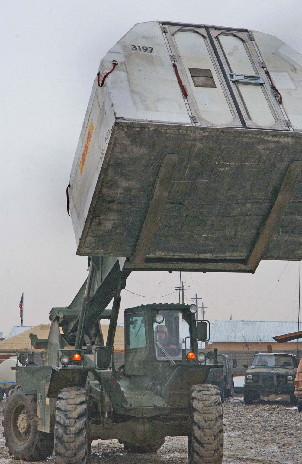 A mail container is being delivered to the Bagram Post Office