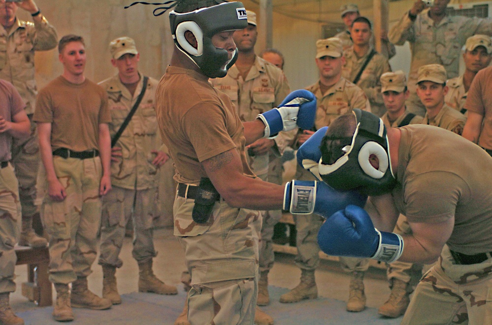 Pvt. Jamal Joseph lands an uppercut on Pfc. Michael Carr