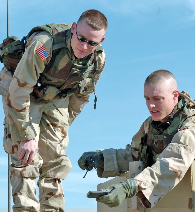 Soldiers check a weapon mount before leaving
