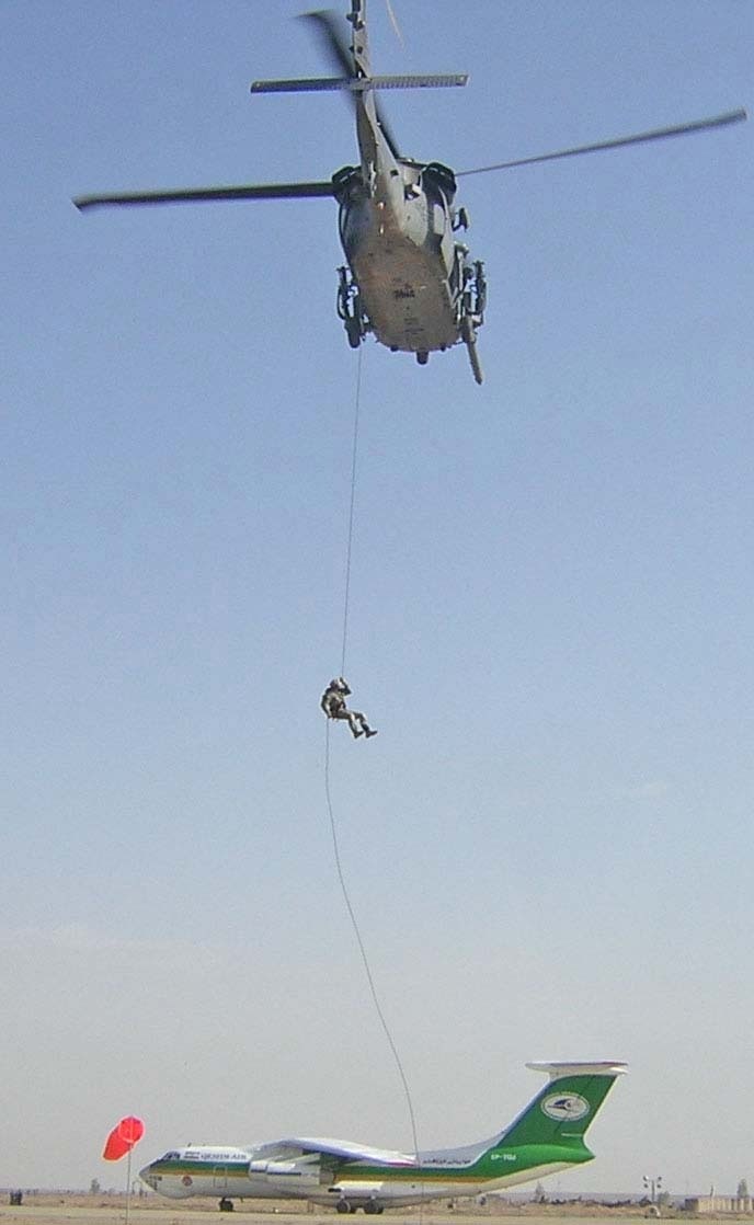 Tan Sirisak practices rappelling from a helicopter 70 feet above