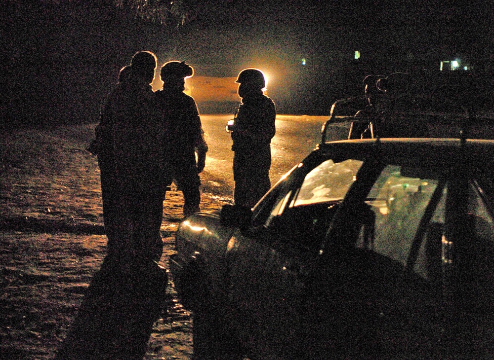 Soldiers speak with motorists stopped