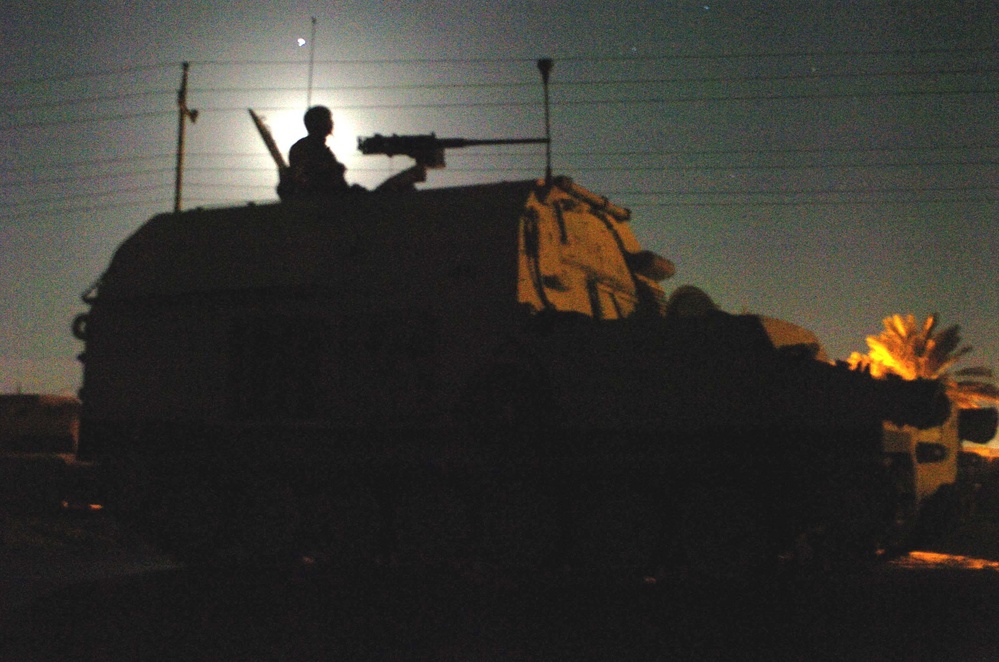 Sgt. Steve Devo mans a .50 caliber machine gun