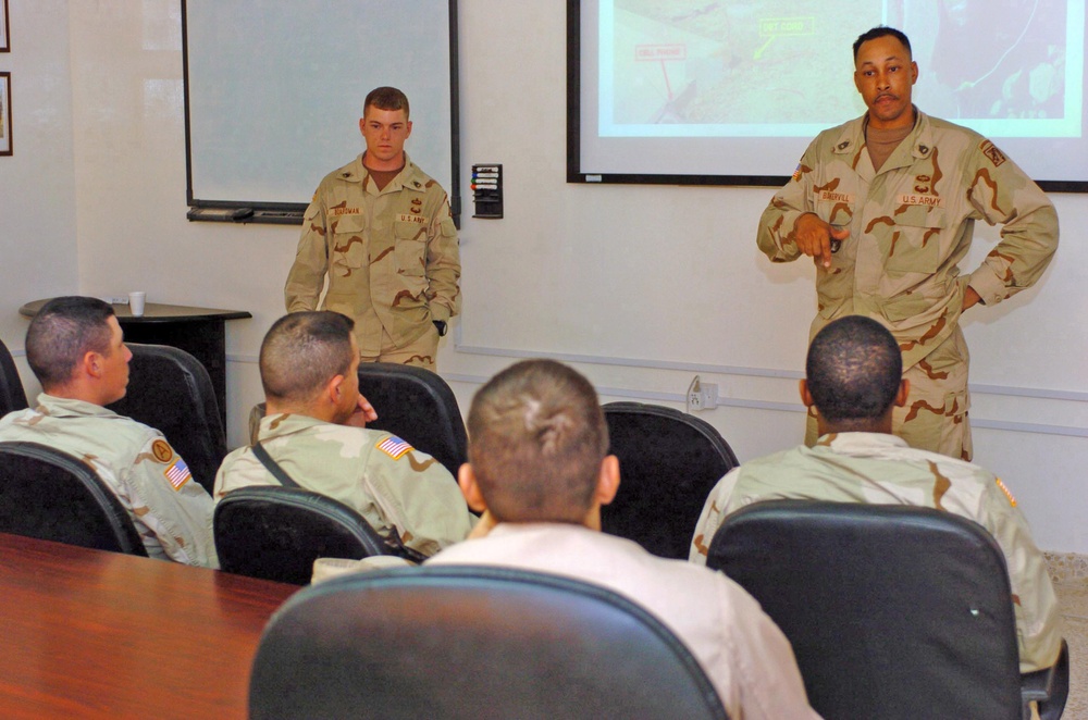 SFC Baskervill and SSgt. Boardman give Soldiers a class on IED