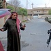Estonian Cpl. Ranno Pettai searches an Iraqi citizen car