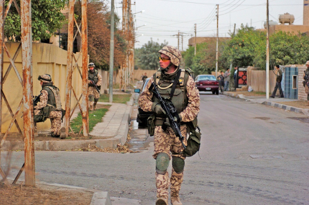 Estonian Cpl. Ranno Pettai patrols a street