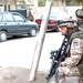 Estonian soldiers guard a street corner in Western Baghdad