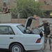Estonian Cpl. Eiko Oim searches a car during patrols