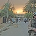 Iraqi children follow Estonian Sgt. Ansar while he patrols