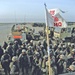 Soldiers listen to a convoy safety brief before continuing