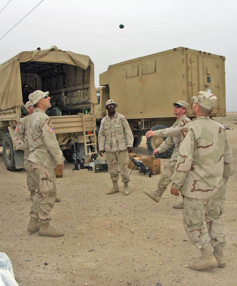 Soldiers relax and enjoy a game of hacky-sac