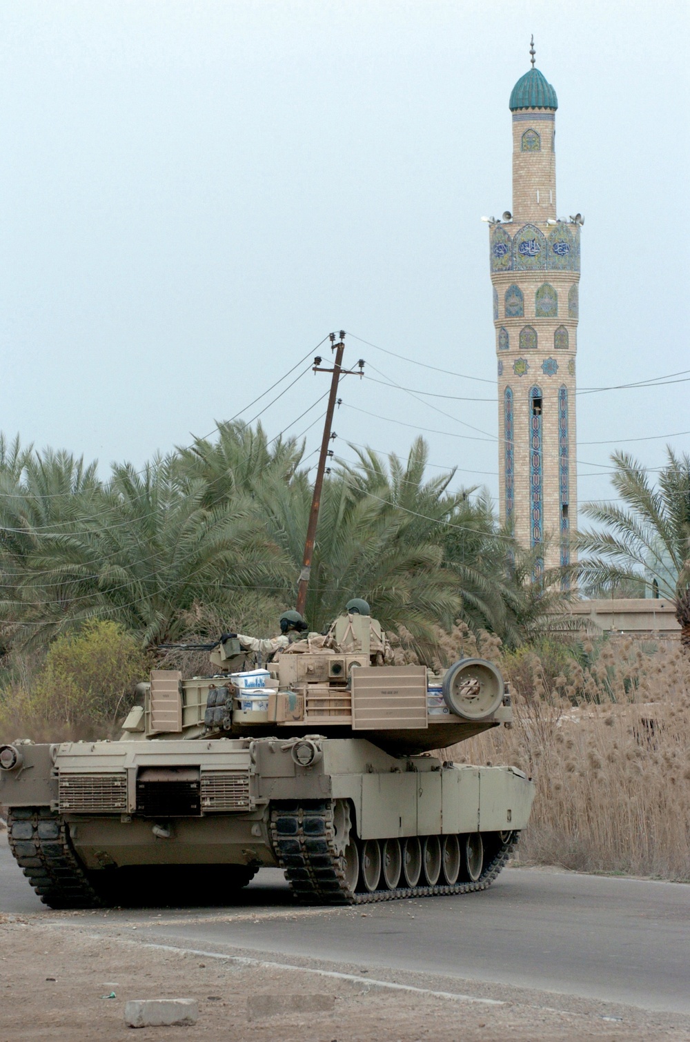 An M1A1 tank secures a road in northern Baghdad