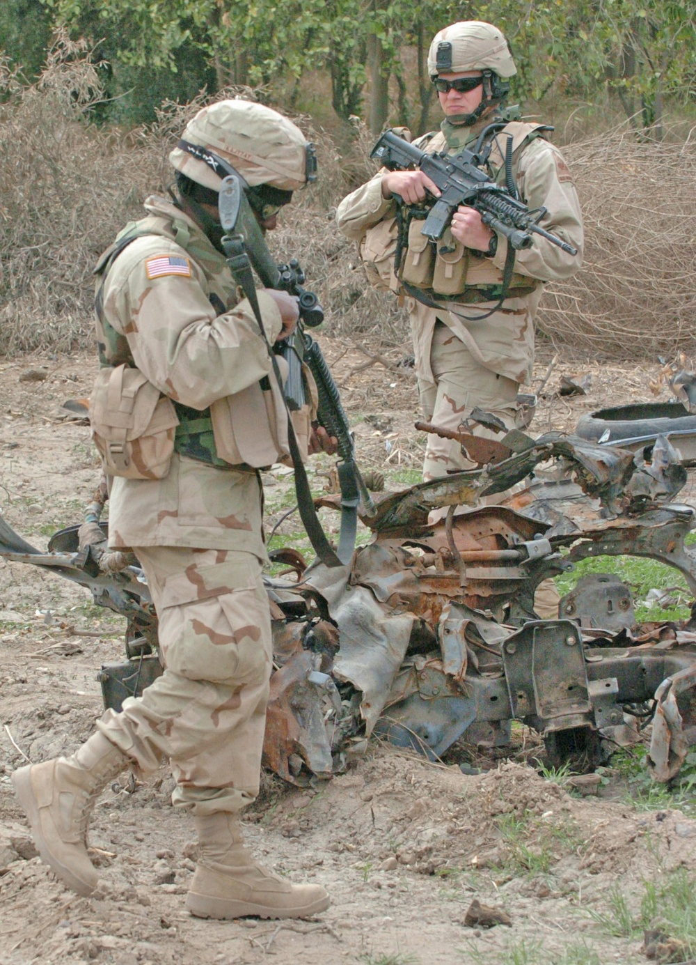 Capt.Spencer and Spc. Joseph search through the wreckage