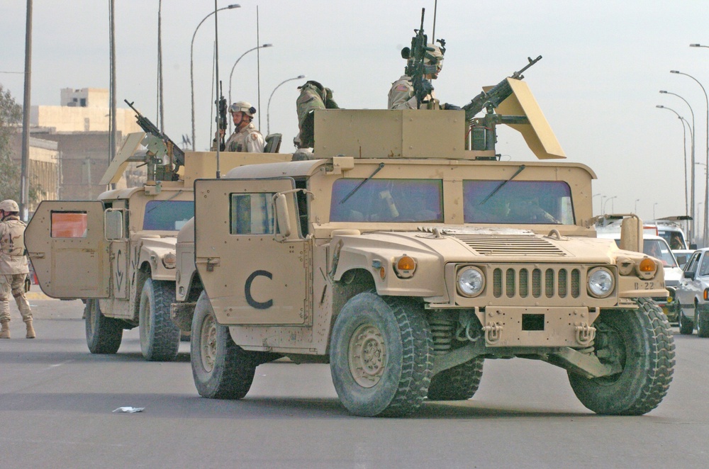 Soldiers cordon off alane of a Baghdad street