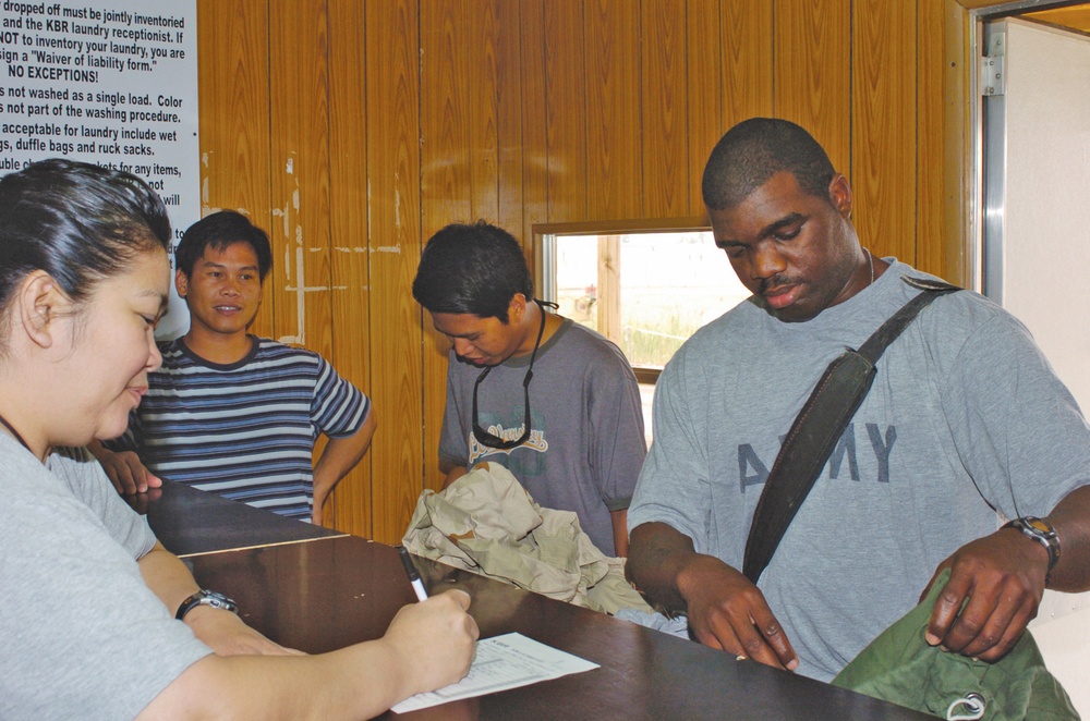 Spc. Jarrod Marshall empties his laundry bag