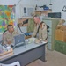 Soldiers discuss an upcoming range in the company training room