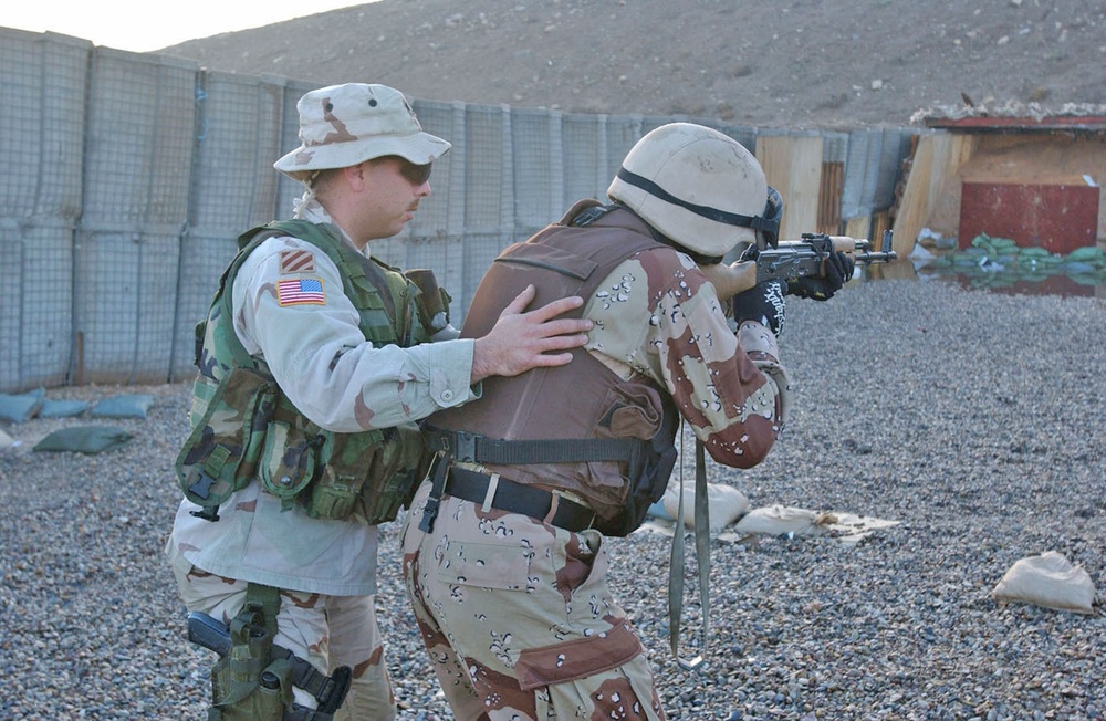 Staff Sgt. Pete Peters Teaches an Iraqi National Guardsman
