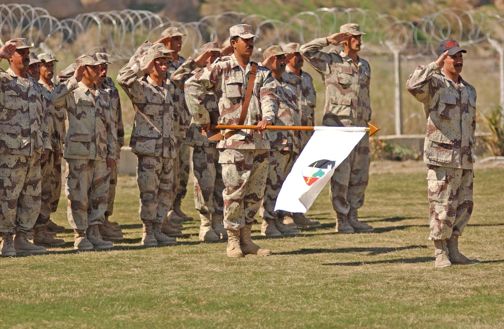 Soldiers stand at present arms during a March 16 ceremony