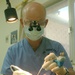 Col. Kraig Kenny performs oral surgery on Maj. McPherson