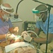 Col. Kenny perform oral surgery on Maj. John McPherson