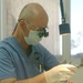 Col. Kraig Kenny performs root canal on Maj. John McPherson