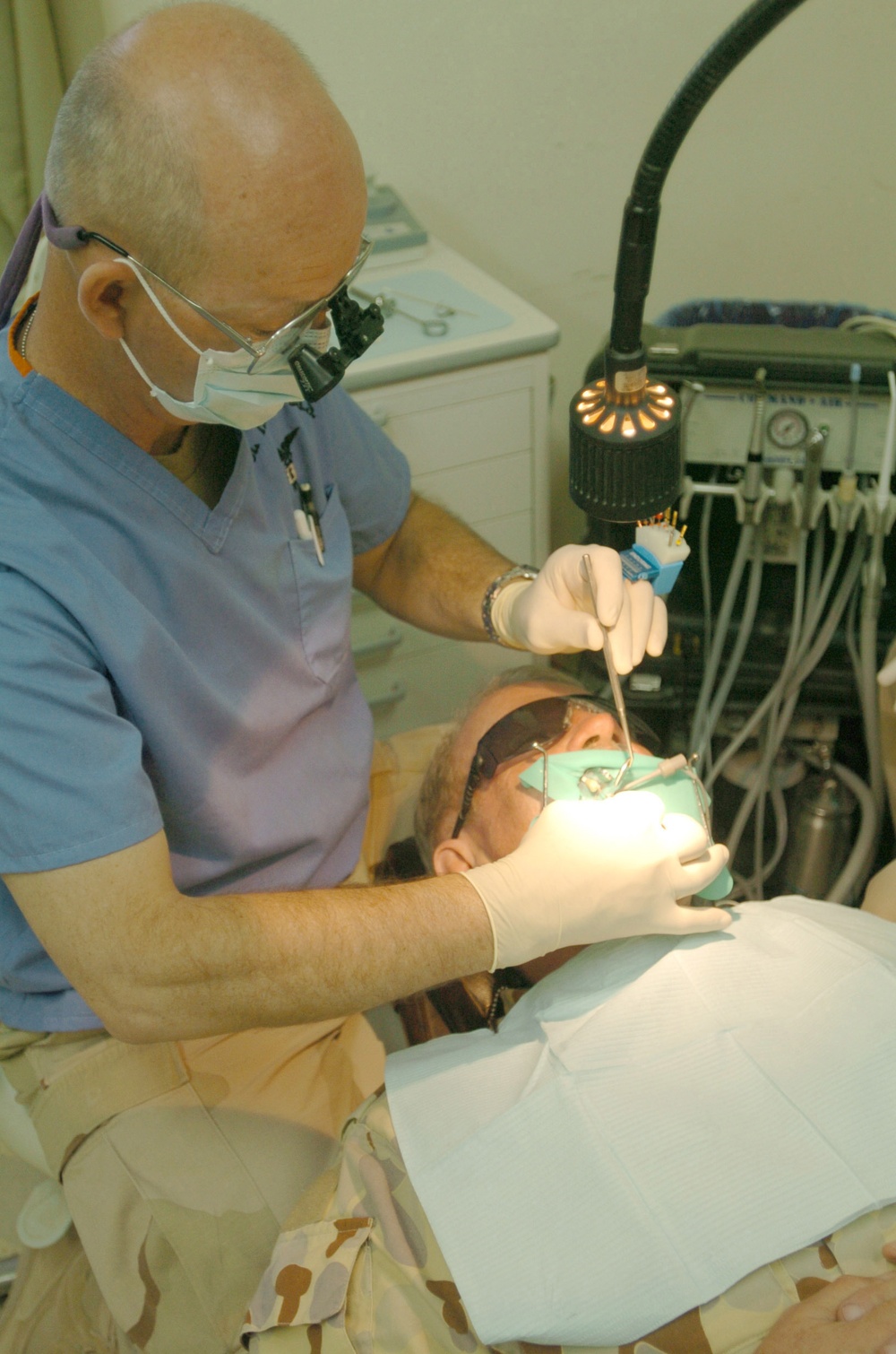 Col. Kenny performs a root canal on Maj. John McPherson