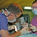Pfc. Tiffany M. Shockley assists Capt. Michael R. Sanders