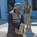 An Iraqi worker helps in the rebuilding