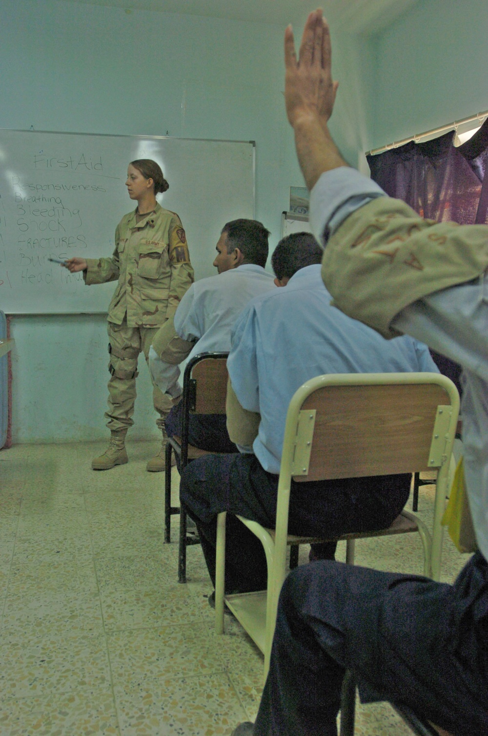 Spc. Crawford teaches a class on first aid to Iraq Police cadets