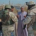 Staff Sgt. Stevie Knox talk with an Iraqi farmer