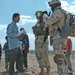 Staff Sgt. Stevie Knox talk with Iraqi children