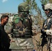 Staff Sgt. Stevie Knox talk with an Iraqi farmer