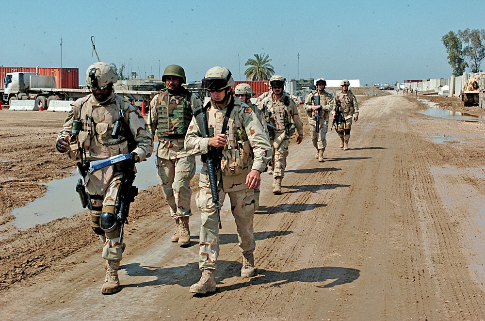 Soldiers set out on a foot patrol at FOB Kalsu