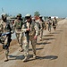 Soldiers set out on a foot patrol at FOB Kalsu