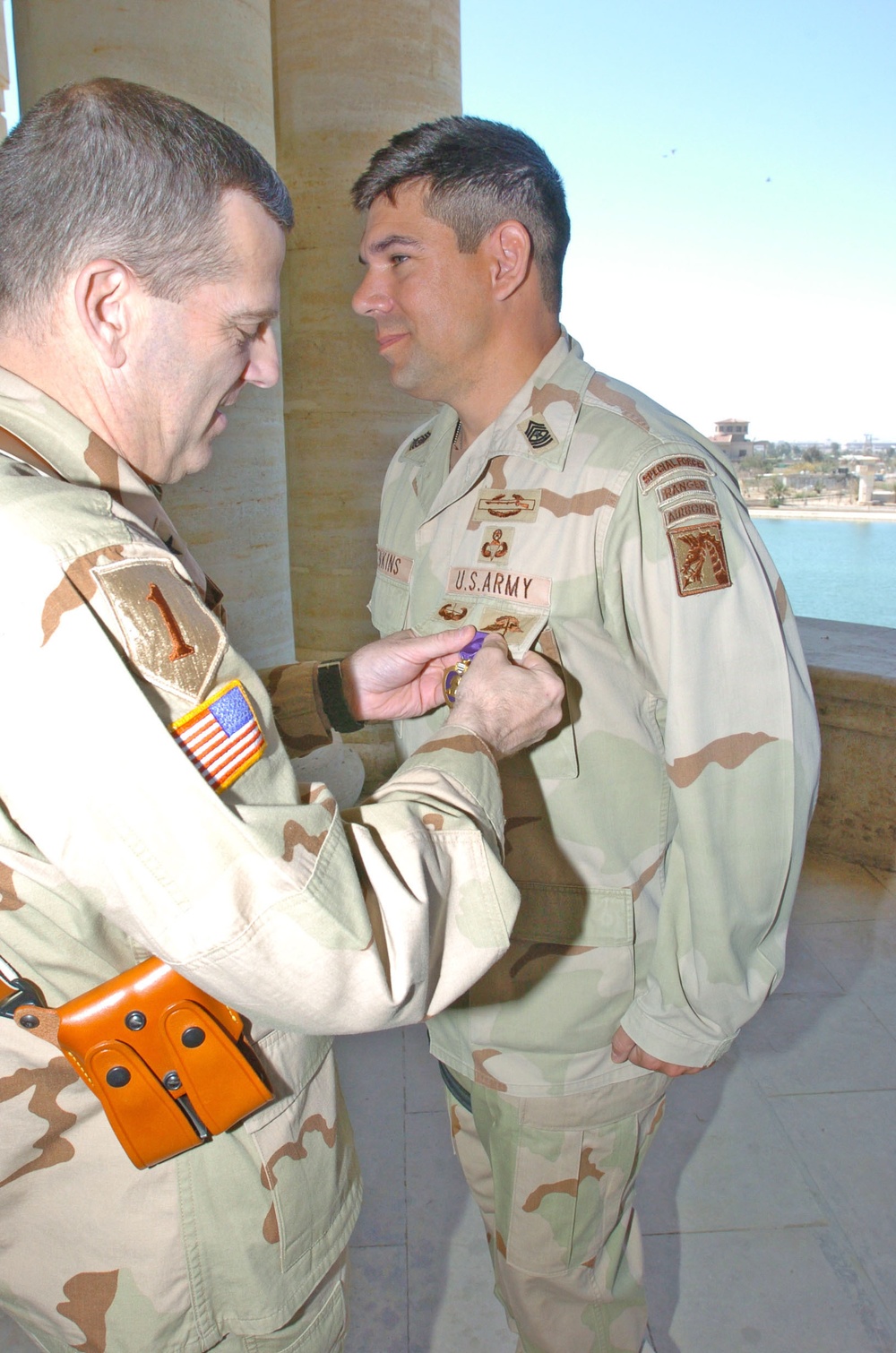 Brig. Gen. Vangjel Pins the Purple Heart on Sgt Maj. Jenkins