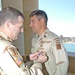 Brig. Gen. Vangjel Pins the Purple Heart on Sgt Maj. Jenkins