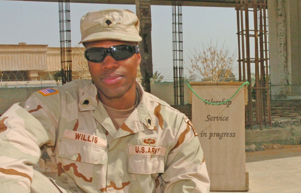 Spc. Daniel Willis Sits Outside the Chapel on Camp Victory