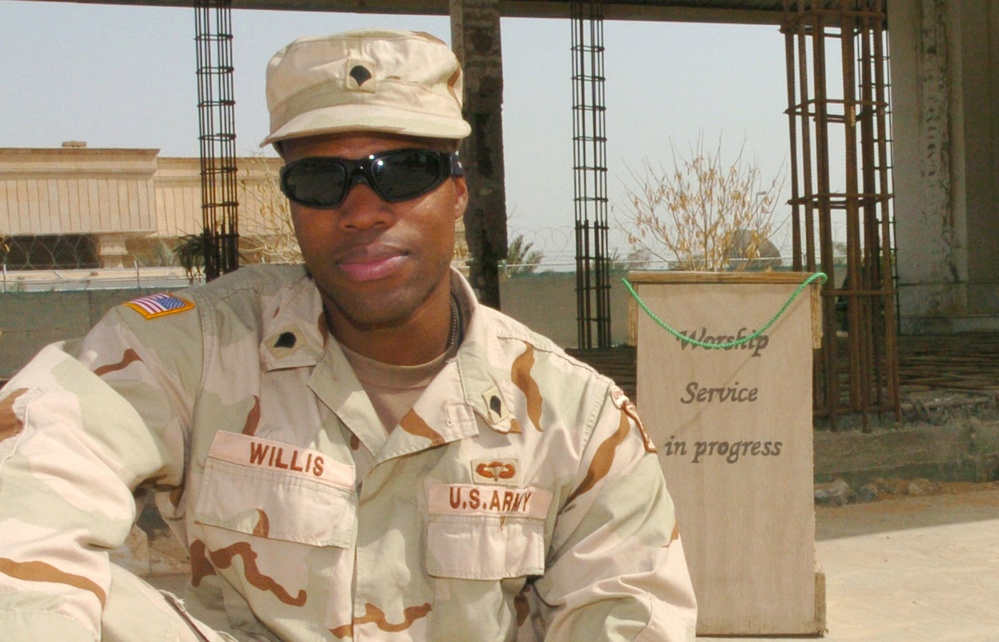 Spc. Daniel Willis Sits Outside the Chapel on Camp Victory