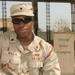 Spc. Daniel Willis Sits Outside the Chapel on Camp Victory