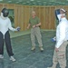 Master Sgt. Ted Bogosh coaches two of his students
