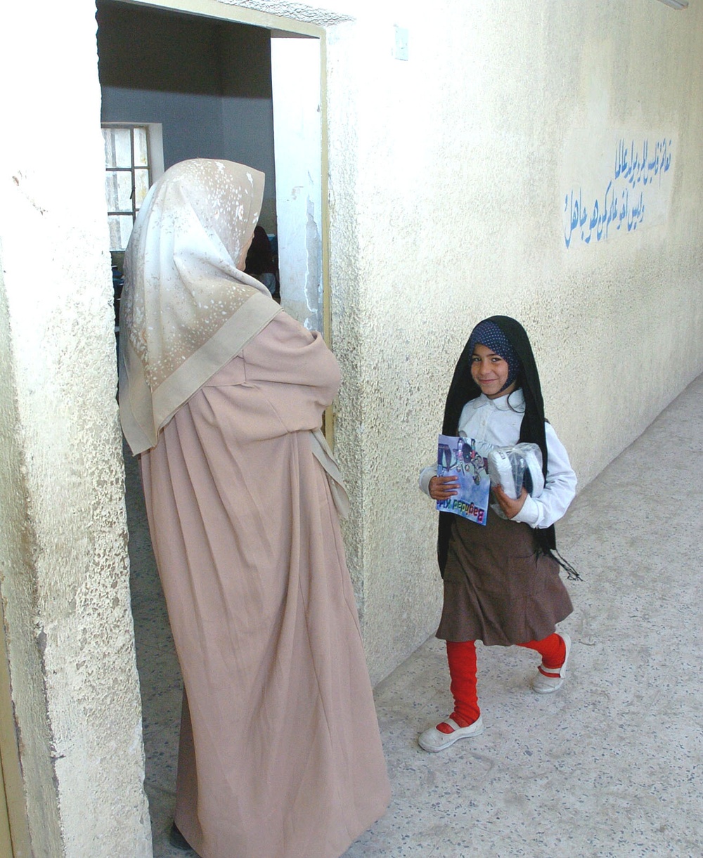 A student happily returns to her classroom