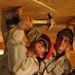 SSgt. Arrigoni and Spc. Doncour nail the ceiling into place