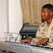 Spc. Jason Peoples accompanies the choir on piano