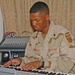 Spc. Jason Peoples accompanies the choir on piano